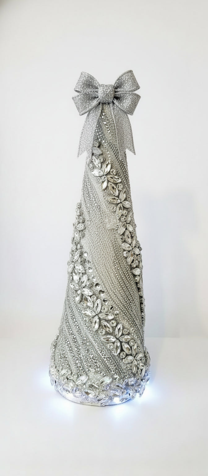 Decorative crystal rhinestone Christmas tree .intricate silver design on a reflective bottom light tree