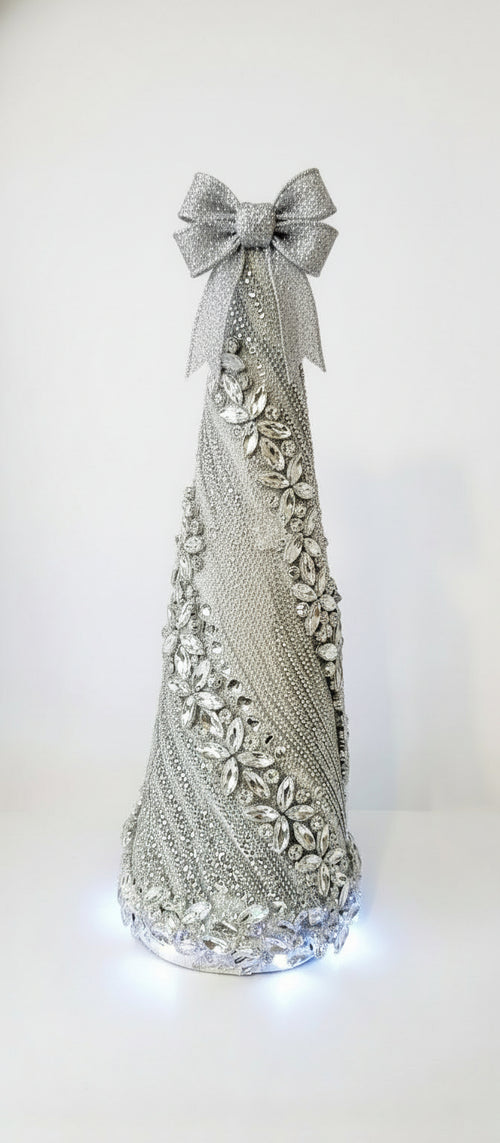 Decorative crystal rhinestone Christmas tree .intricate silver design on a reflective bottom light tree