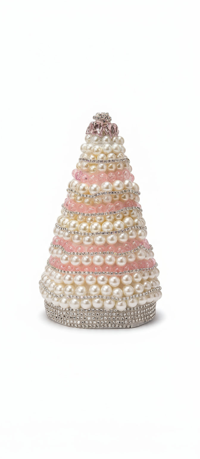 Decorative Christmas tree made of pearls on a reflective surface