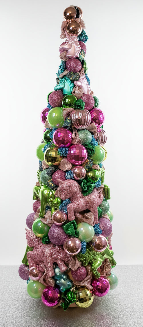 Decorative Unicorn Christmas tree made of colorful ornaments on a plain background